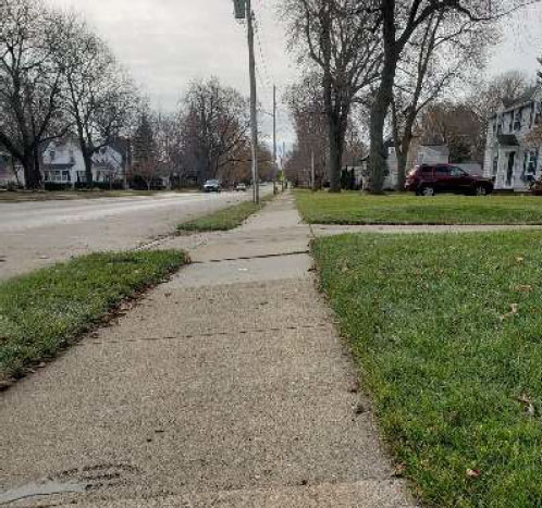 Sidewalk Has Tilted Towards The Road